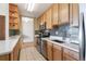 Updated kitchen with stainless steel appliances and wood cabinets at 3100 E Cherry Creek South Dr # 303, Denver, CO 80209