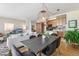 Dining area with dark wood table and modern light fixture at 3100 E Cherry Creek South Dr # 303, Denver, CO 80209