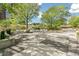 Community patio with tables, chairs, and grill at 3100 E Cherry Creek South Dr # 303, Denver, CO 80209