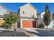 Tan three-bedroom home with a two car garage at 4635 Crestone Peak St, Brighton, CO 80601