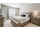 Spacious main bedroom with king-size bed and large window at 15700 E Jamison Dr # 8-103, Englewood, CO 80112