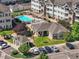 Aerial view of apartment community with pool, clubhouse, and parking at 15700 E Jamison Dr # 8-103, Englewood, CO 80112