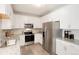 Modern kitchen with stainless steel appliances and granite countertops at 15700 E Jamison Dr # 8-103, Englewood, CO 80112