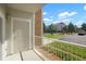 Covered patio with door access and community view at 15700 E Jamison Dr # 8-103, Englewood, CO 80112