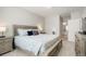 Main bedroom with king-size bed and access to the bathroom at 15700 E Jamison Dr # 8-103, Englewood, CO 80112