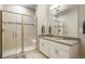 Bathroom with double vanity, granite countertops and a shower at 15700 E Jamison Dr # 8-103, Englewood, CO 80112