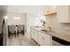 White shaker cabinets, granite countertops, and stainless steel appliances at 15700 E Jamison Dr # 8-103, Englewood, CO 80112