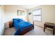 Cozy bedroom with double bed and window views at 6073 County Road 20, Longmont, CO 80504