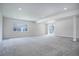 Finished basement with gray carpeting and sliding doors at 5072 Ditmars Ln, Castle Rock, CO 80104