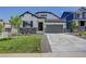 Modern farmhouse style home with gray garage door and landscaping at 5072 Ditmars Ln, Castle Rock, CO 80104