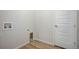 Bright laundry room with built-in cabinets and vinyl flooring at 5072 Ditmars Ln, Castle Rock, CO 80104