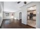 Open living room with view into kitchen and hardwood floors at 3350 Olive St, Denver, CO 80207