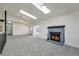 Living room with updated fireplace, ample natural light, and new carpeting at 3754 S Mission Pkwy, Aurora, CO 80013