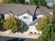 Aerial view of the townhouse, highlighting its gray siding at 1355 S Ulster St, Denver, CO 80231