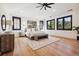 Main bedroom with hardwood floors and large windows at 2511 S Columbine St, Denver, CO 80210