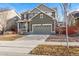 Inviting two-story home with front porch, attached garage, and well-maintained landscaping at 14934 Vienna Cir, Parker, CO 80134