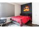 Bright bedroom with red bedding and large window at 1323 Elati St # 3, Denver, CO 80204