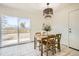 Kitchen dining area with sliding door to backyard at 5515 Chandler Ct, Denver, CO 80239