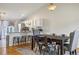 Open concept dining room adjacent to kitchen with a breakfast bar at 12195 Grape St, Thornton, CO 80241