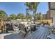 Relaxing backyard deck with seating area, grill and fire pit at 7761 W Ottawa Pl, Littleton, CO 80128