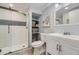 Clean basement bathroom with subway tile shower and white vanity at 7761 W Ottawa Pl, Littleton, CO 80128