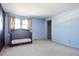 Blue bedroom with crib and ample closet space at 1200 S Monaco St Pkwy # 31, Denver, CO 80224