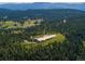Aerial view of property showing home and surrounding land at 24503 Chris Dr, Evergreen, CO 80439