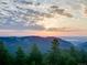 Scenic mountain view at sunrise with a beautiful sky at 24503 Chris Dr, Evergreen, CO 80439