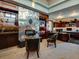 Spacious home office with fireplace, built-in shelving, and large windows at 24503 Chris Dr, Evergreen, CO 80439