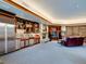 Finished basement with wet bar, fireplace, and sitting area at 24503 Chris Dr, Evergreen, CO 80439