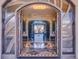 Grand entry with arched doorways, marble floors, and a fireplace at 24503 Chris Dr, Evergreen, CO 80439