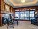 Spacious home office with fireplace and large windows at 24503 Chris Dr, Evergreen, CO 80439