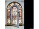 Elegant wine cellar with wrought iron door and extensive shelving at 24503 Chris Dr, Evergreen, CO 80439