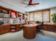 Home office with built-in cabinetry and a large desk at 24503 Chris Dr, Evergreen, CO 80439