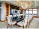 Formal dining room featuring a large table and fireplace at 24503 Chris Dr, Evergreen, CO 80439
