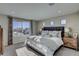 Main bedroom with large window and wood dresser at 1189 Sugarloaf Ln, Erie, CO 80516