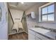 Laundry room with sink, storage, and window at 1189 Sugarloaf Ln, Erie, CO 80516