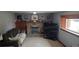 Finished basement with a fireplace, TV area, and comfortable seating at 8120 S Jay Dr, Littleton, CO 80128