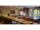 Spacious kitchen with granite countertops, breakfast bar, and ample cabinet space at 8120 S Jay Dr, Littleton, CO 80128