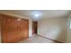 Simple bedroom with double-door closet and neutral colored walls at 8120 S Jay Dr, Littleton, CO 80128