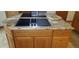Granite countertop kitchen island with double cooktops and ample storage at 8120 S Jay Dr, Littleton, CO 80128