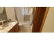 Clean bathroom with tub, shower, and granite vanity at 8120 S Jay Dr, Littleton, CO 80128