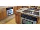 Modern kitchen with granite countertops and stainless steel appliances at 8120 S Jay Dr, Littleton, CO 80128