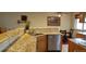Kitchen features granite countertops, stainless steel appliances, and breakfast bar at 8120 S Jay Dr, Littleton, CO 80128