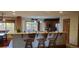 Large kitchen featuring granite countertops, island, and lots of natural light at 8120 S Jay Dr, Littleton, CO 80128