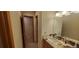 Bathroom boasts granite vanity, linen closet, and a sizable mirror at 8120 S Jay Dr, Littleton, CO 80128