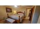 Bright bedroom with a wooden post bed and carpet flooring at 8120 S Jay Dr, Littleton, CO 80128