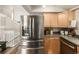 Stainless steel refrigerator in a kitchen with light wood cabinets at 3361 W 134Th Ave, Broomfield, CO 80020