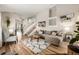 Open concept living room with hardwood floors and sectional sofa at 3361 W 134Th Ave, Broomfield, CO 80020