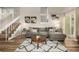 Light-filled living room featuring a comfortable sectional sofa and wood-look flooring at 3361 W 134Th Ave, Broomfield, CO 80020